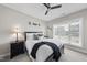 This bedroom has soft natural light, a ceiling fan, and neutral carpet at 2907 Jakes View Pt, Fuquay Varina, NC 27526