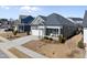 Beautiful view of the home's exterior, showcasing its landscaped yard and suburban setting at 2907 Jakes View Pt, Fuquay Varina, NC 27526