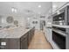 Spacious kitchen features a large island with granite countertops and modern appliances at 2907 Jakes View Pt, Fuquay Varina, NC 27526