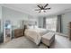 This spacious main bedroom features soft colors, plush carpet, and a ceiling fan at 2907 Jakes View Pt, Fuquay Varina, NC 27526