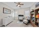 This home office features plenty of natural light and shelving at 2907 Jakes View Pt, Fuquay Varina, NC 27526
