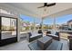 Relaxing screened porch with comfortable seating and a ceiling fan, perfect for enjoying the outdoors at 2907 Jakes View Pt, Fuquay Varina, NC 27526