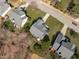 An aerial view shows the roof, yard and neighborhood streets surrounding this well maintained home at 3003 Cregler Dr, Apex, NC 27502