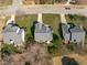An aerial view shows the roof, yard and neighborhood streets surrounding this well maintained home at 3003 Cregler Dr, Apex, NC 27502