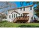 Back exterior view of a home, showcasing a deck, patio, and grassy yard at 3003 Cregler Dr, Apex, NC 27502