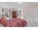 Carpeted primary bedroom features a vaulted ceiling, ceiling fan, and ensuite access to the primary bathroom at 3003 Cregler Dr, Apex, NC 27502