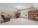 Spacious bonus room with sloped ceilings, comfortable chair, and a desk area at 3003 Cregler Dr, Apex, NC 27502