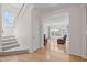 Inviting foyer with stairs and hardwood floors leading into the living room at 3003 Cregler Dr, Apex, NC 27502