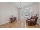 Comfortable living room featuring a bay window, hardwood floors, and a recliner at 3003 Cregler Dr, Apex, NC 27502