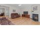 Spacious living room features hardwood floors, fireplace, and large TV for entertainment at 3003 Cregler Dr, Apex, NC 27502