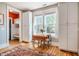 Sunny breakfast nook featuring large windows and built-in storage at 314 Tobacco Farm Way, Chapel Hill, NC 27516