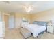 Bright bedroom with ample natural light, neutral walls, ceiling fan, and classic furnishings at 319 Brinkley Cir, Mebane, NC 27302