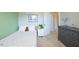 This bedroom features a twin bed, neutral carpet, grey walls, and closet with white doors at 319 Brinkley Cir, Mebane, NC 27302