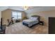 Bright upstairs bedroom featuring a bed and exercise equipment in a naturally lit, spacious area at 319 Brinkley Cir, Mebane, NC 27302