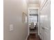 Hallway leading to dining room with natural light and hardwood floors. Door to the right at 319 Brinkley Cir, Mebane, NC 27302