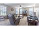 A cozy living room with neutral tones, plush seating, and an entertainment center for relaxed living at 319 Brinkley Cir, Mebane, NC 27302