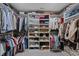 Spacious walk-in closet with ample shelving and hanging storage for clothes, shoes, and accessories at 3408 Dropseed Dr, Apex, NC 27502