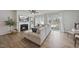 Spacious living area with a fireplace, hardwood floors, and abundant natural light at 3408 Dropseed Dr, Apex, NC 27502