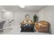 Inviting basement with tan sofas and black coffee table at 3408 Dropseed Dr, Apex, NC 27502