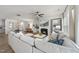 Spacious living room featuring a modern fireplace, large sectional, and dining area at 3408 Dropseed Dr, Apex, NC 27502