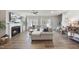 Bright living room with a fireplace, ceiling fan, and cozy sectional sofa at 3408 Dropseed Dr, Apex, NC 27502