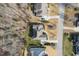 An aerial view of a well-maintained home with a lush green lawn and professional landscaping at 363 Rolling Meadows Ln, Chapel Hill, NC 27517