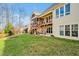 Backyard view showcases a spacious deck, patio, and lush green lawn perfect for outdoor entertaining at 363 Rolling Meadows Ln, Chapel Hill, NC 27517
