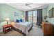 Comfortable bedroom with natural light, large window, and neutral decor at 363 Rolling Meadows Ln, Chapel Hill, NC 27517