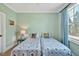 Bright bedroom showcases a twin bed setup, complemented by a window for natural light and colorful decor at 363 Rolling Meadows Ln, Chapel Hill, NC 27517