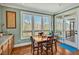 Inviting breakfast nook filled with natural light from large windows showcasing the wooded lot at 363 Rolling Meadows Ln, Chapel Hill, NC 27517