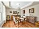 Elegant dining room with classic furnishings, chandelier lighting, and hardwood flooring at 363 Rolling Meadows Ln, Chapel Hill, NC 27517