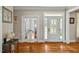 Inviting foyer boasts gleaming hardwood floors and a beautifully designed front door at 363 Rolling Meadows Ln, Chapel Hill, NC 27517