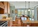 Spacious kitchen with granite counters, wooden cabinets and stainless steel appliances at 363 Rolling Meadows Ln, Chapel Hill, NC 27517