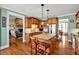 Kitchen with a large island with granite counters, hardwood floors, and stainless steel appliances at 363 Rolling Meadows Ln, Chapel Hill, NC 27517