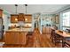 Well-designed kitchen boasts hardwood floors, granite countertops, and stainless steel appliances at 363 Rolling Meadows Ln, Chapel Hill, NC 27517