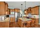 Bright kitchen featuring stainless steel appliances, granite counters, and a convenient center island at 363 Rolling Meadows Ln, Chapel Hill, NC 27517