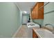 Functional laundry area with modern appliances, ample storage, and a utility sink at 363 Rolling Meadows Ln, Chapel Hill, NC 27517