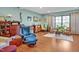 Spacious living area with hardwood floors, a variety of seating options, and unique decor at 363 Rolling Meadows Ln, Chapel Hill, NC 27517