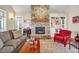 Living room featuring stone fireplace and custom shelving at 363 Rolling Meadows Ln, Chapel Hill, NC 27517