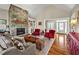 Open-concept living room featuring a stunning stone fireplace at 363 Rolling Meadows Ln, Chapel Hill, NC 27517