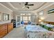 Relaxing main bedroom with balcony access, ceiling fan, and dresser at 363 Rolling Meadows Ln, Chapel Hill, NC 27517