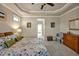 Calm main bedroom showcasing soft lighting, decor, and private doorway at 363 Rolling Meadows Ln, Chapel Hill, NC 27517