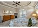 A bright main bedroom with a ceiling fan, balcony access, and dresser at 363 Rolling Meadows Ln, Chapel Hill, NC 27517