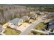 Street view of several homes in a residential neighborhood with meticulously maintained lawns and landscaping at 363 Rolling Meadows Ln, Chapel Hill, NC 27517