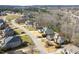 A street view of homes in a residential area showing mature trees and beautiful lawns at 363 Rolling Meadows Ln, Chapel Hill, NC 27517