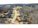 A street view of multiple homes nestled in a lovely neighborhood surrounded by nature and trees at 363 Rolling Meadows Ln, Chapel Hill, NC 27517