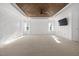 Large bedroom featuring a coffered ceiling, white walls, and large windows at 3633 Jordan Shires Dr, New Hill, NC 27562
