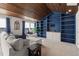 Bonus room featuring built-in shelving, wood accents, and comfortable seating at 3633 Jordan Shires Dr, New Hill, NC 27562