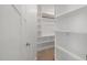 Bright walk-in closet with white shelving and ample storage space at 3633 Jordan Shires Dr, New Hill, NC 27562