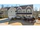 Beautiful two-story home with a two-car garage, inviting front porch, and manicured front yard at 3633 Jordan Shires Dr, New Hill, NC 27562